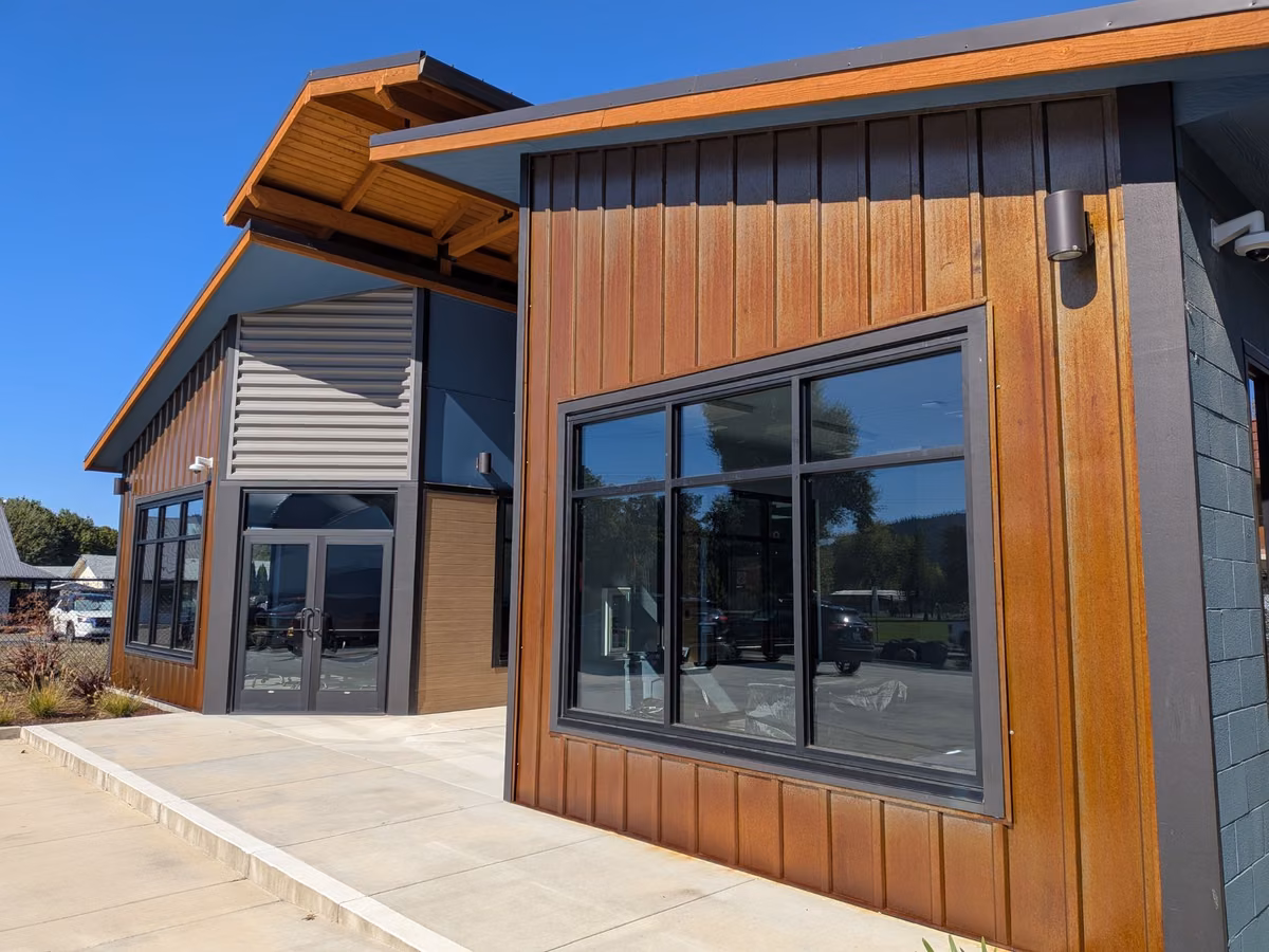Commercial building after painting, with windows uncovered and clean trim